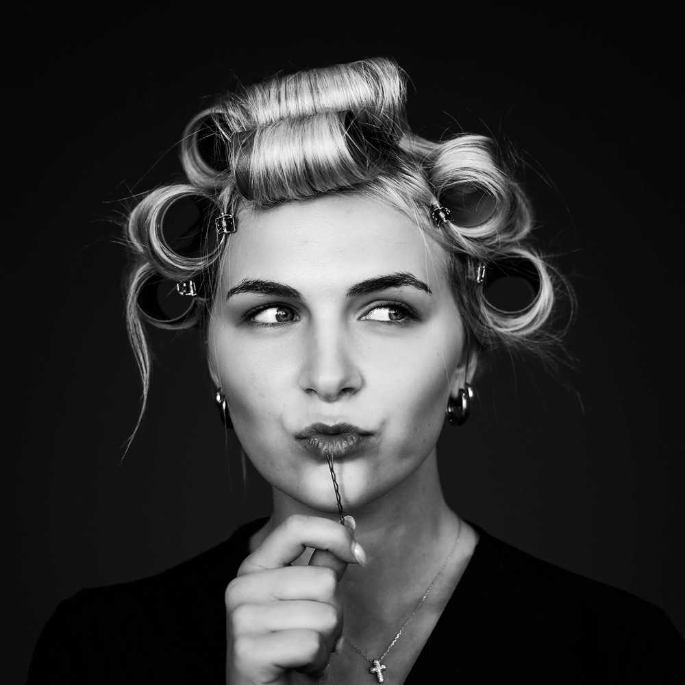 Student styling hair at City Pointe Beauty Academy